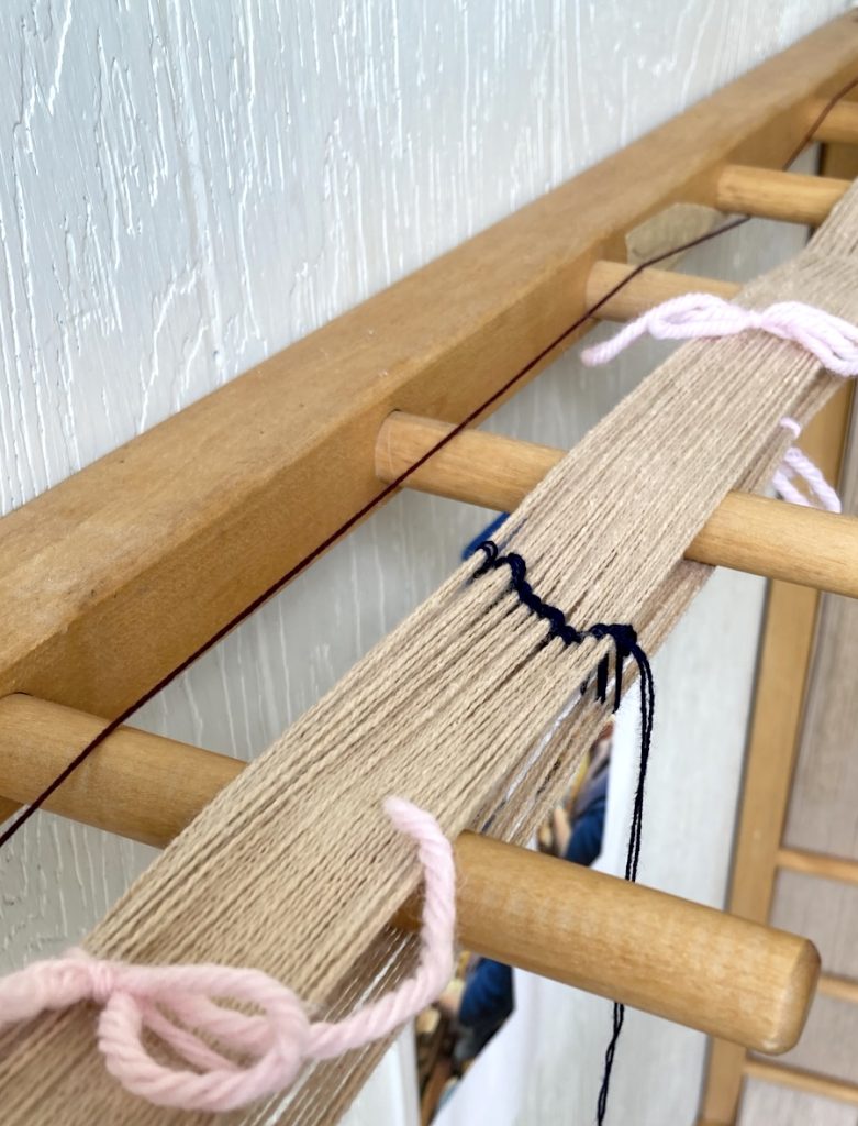 Warp fibers prepared on a warping board