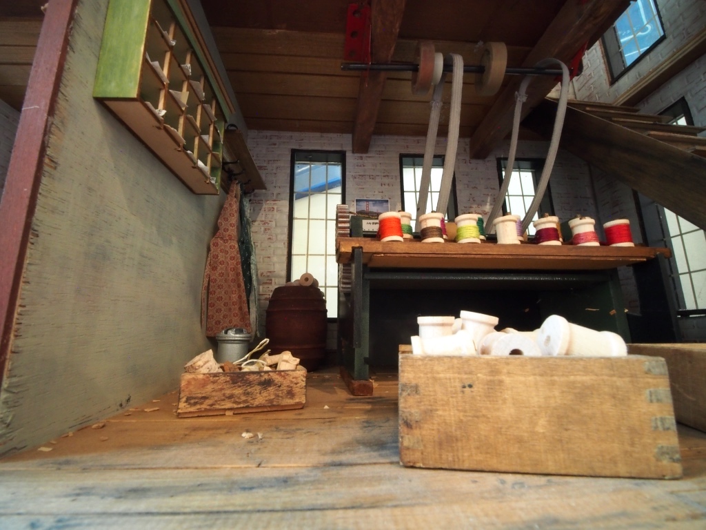 A view inside a model of a thread mill displayed as part of the Thread City permanent exhibit.